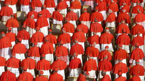 Group photo of priests wearing red.