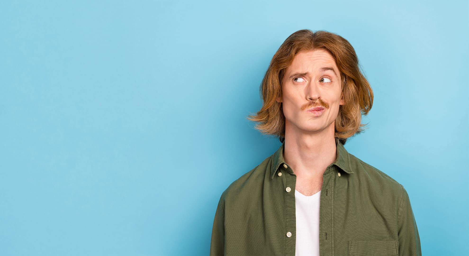 Young white man with ginger hair looking confused