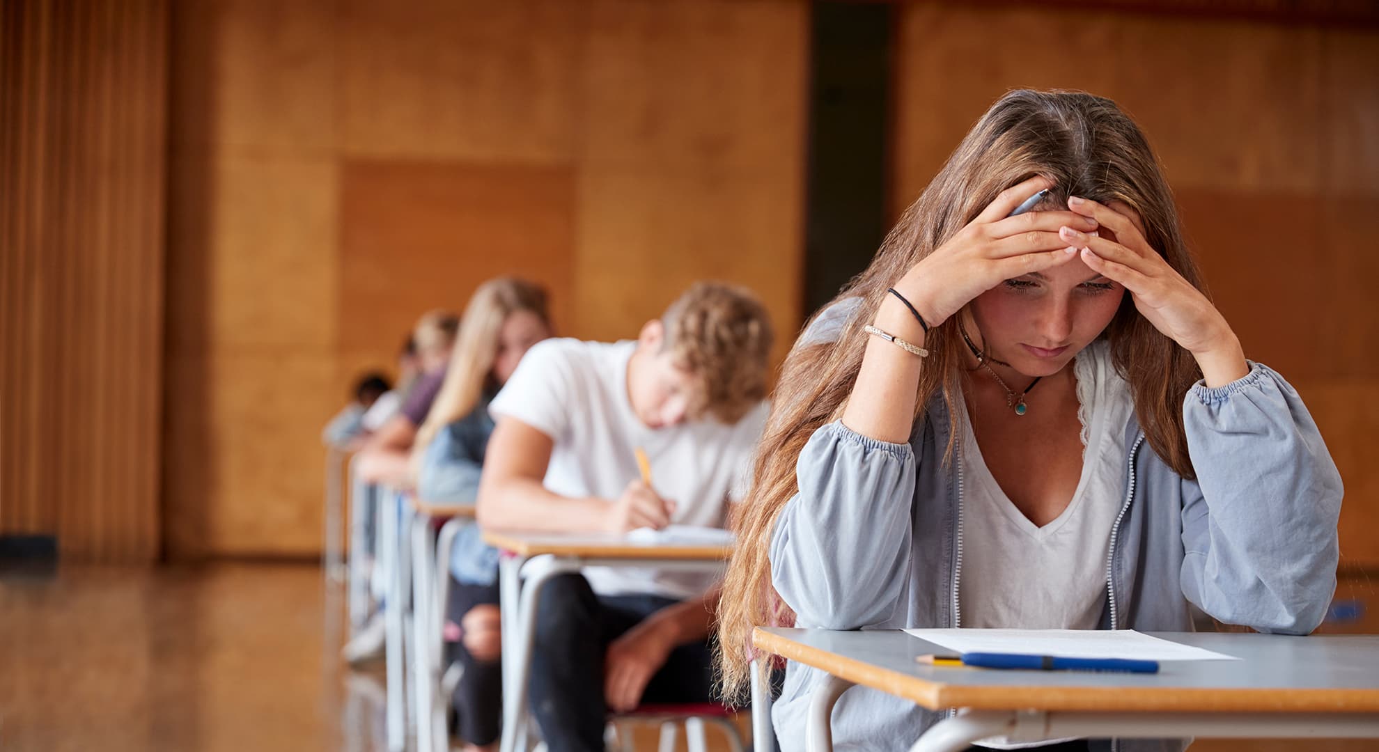 Young students sitting an exam