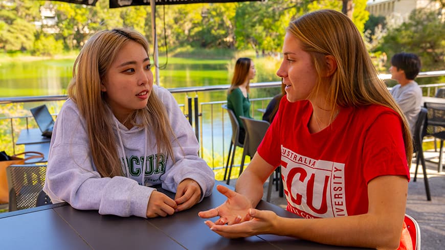 Two young women at a university campus