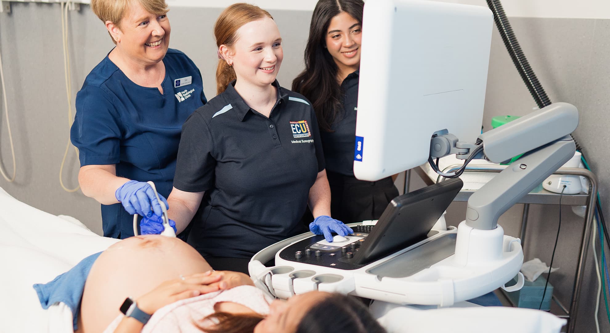 People working in a sonography facility.