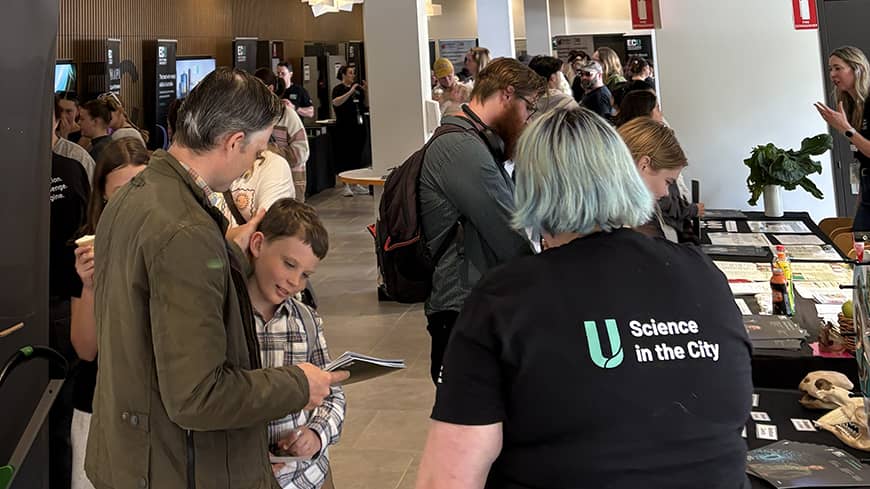 Groups of people looking at ECU displays