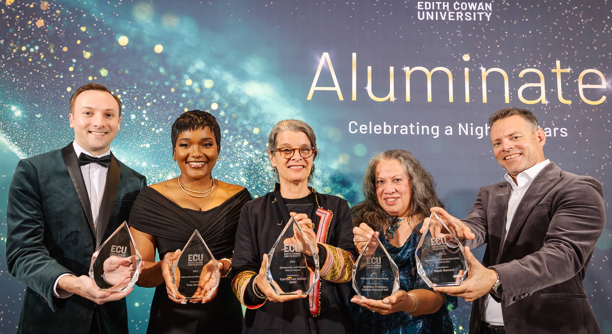 People standing in a line with awards