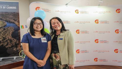 Two women face the camera for a photo