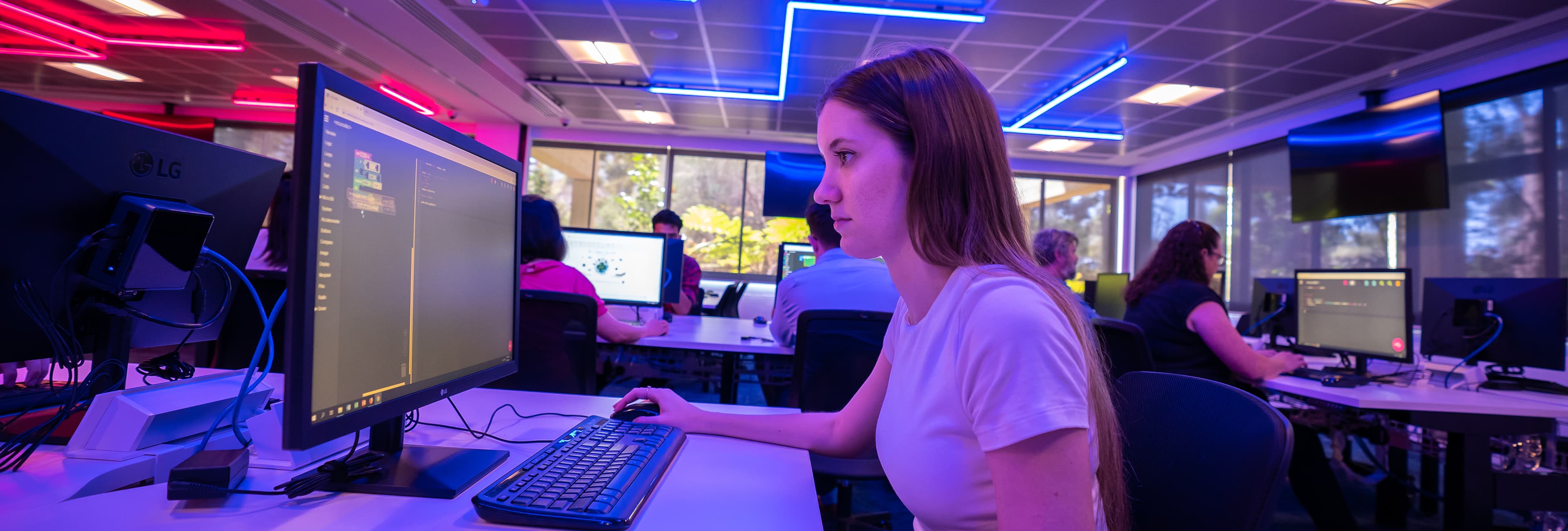 Girl sitting on front of computer