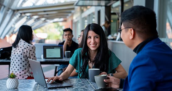 Two students sitting at Plantation cafe on Joondalup campus