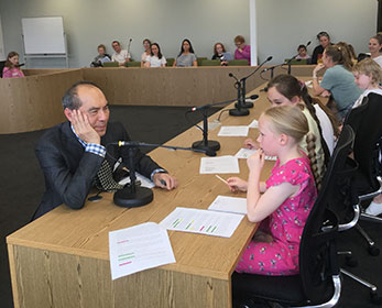 Children's University participants took the roles of counsel, witnesses and jury in a mock trial as part of a Children's University holiday program