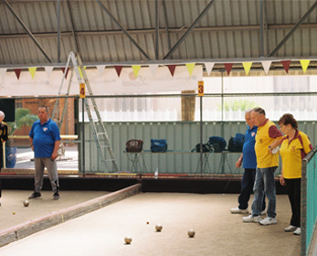 People playing lawn bowls.