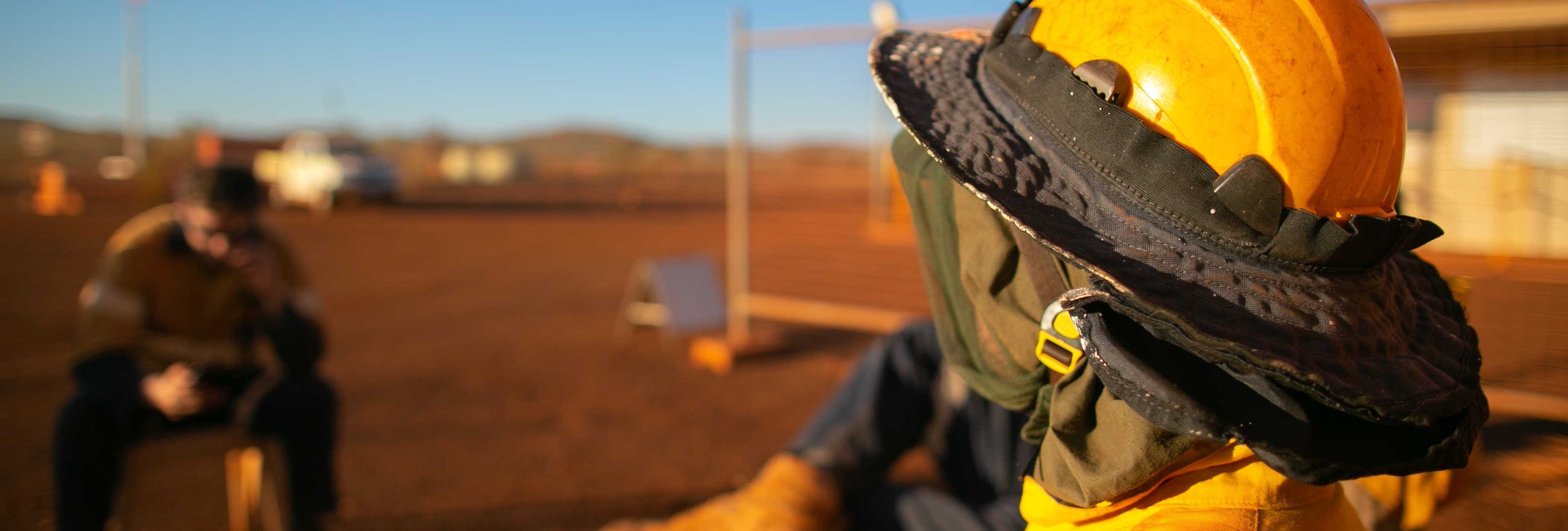 Rear view of a mine worker wearing a hard hat