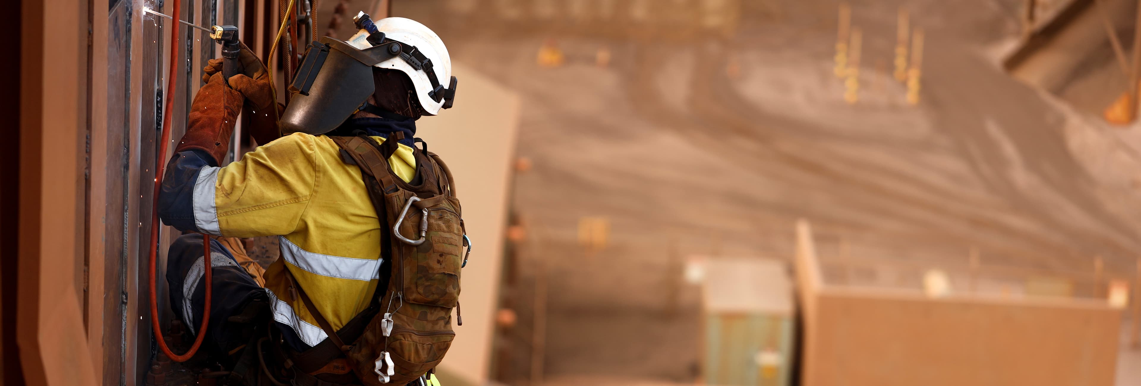 mining industry worker welding