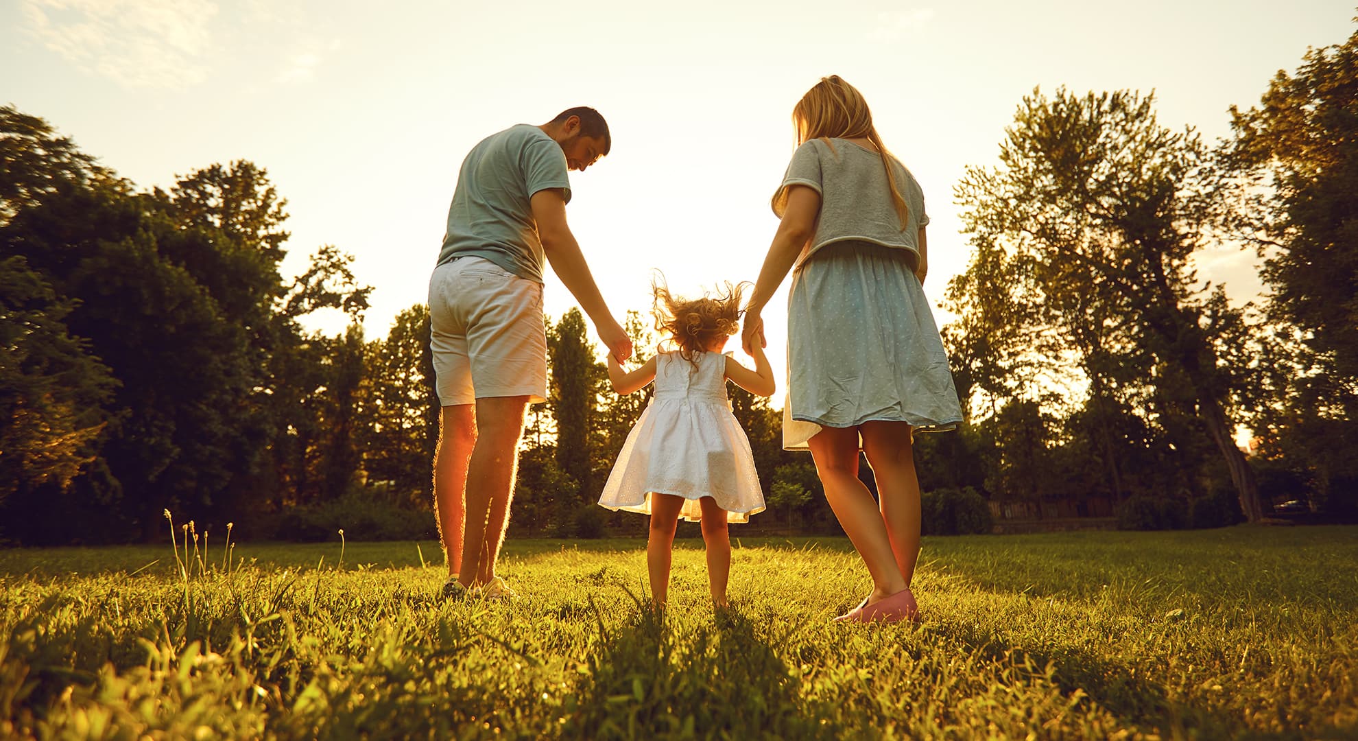 family in the park at sunset