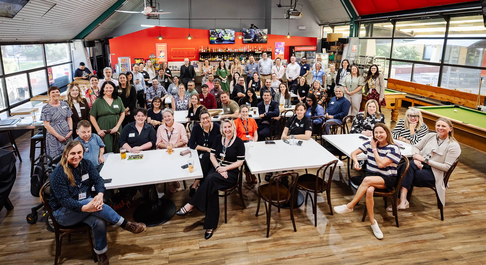 Group photo of ECU Staff Giving community celebrating impact of scholarships at Birra Bar, ECU Joondalup.