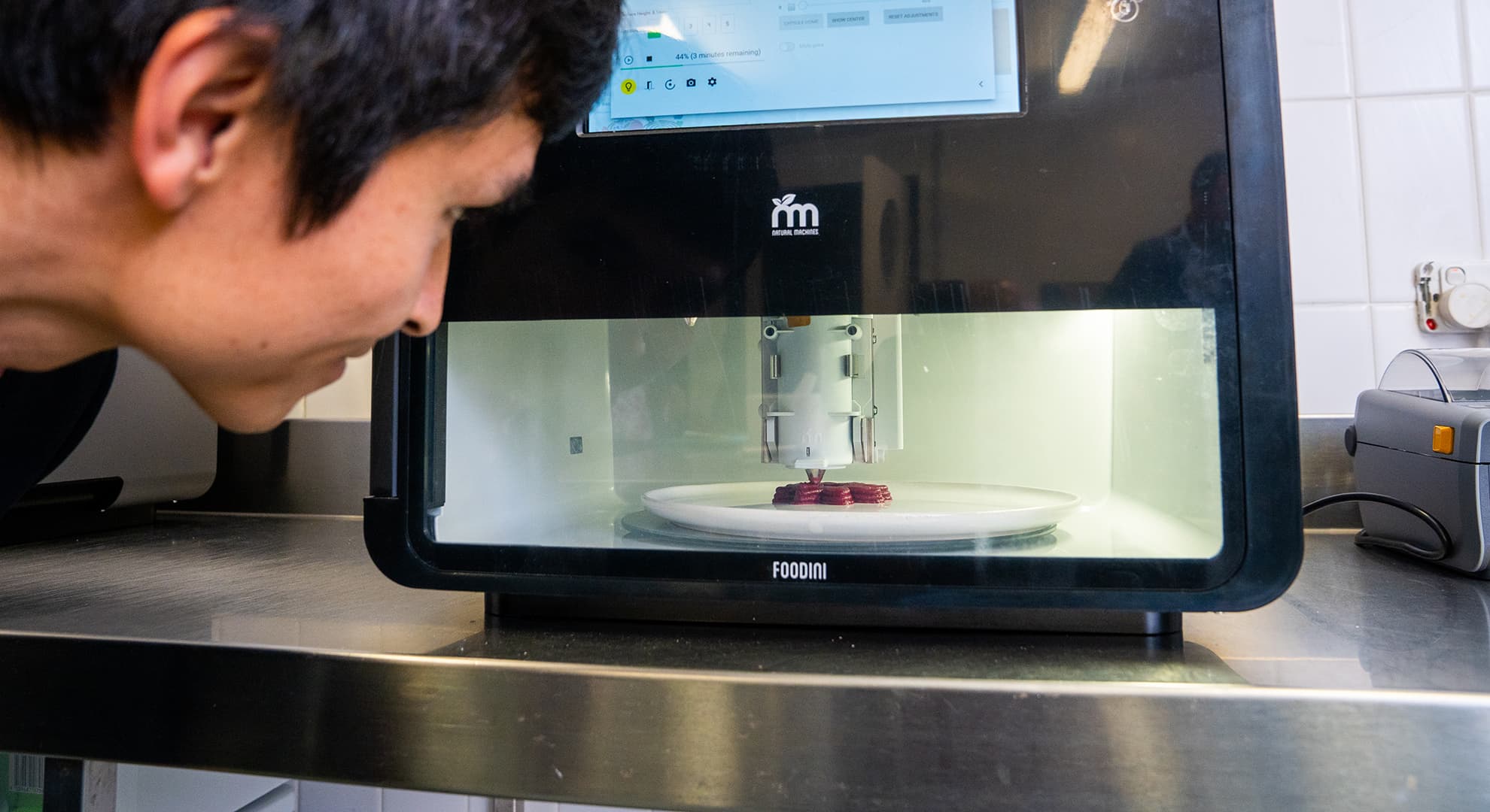 Dr Liezhou Zhong looking into 3D food printer.