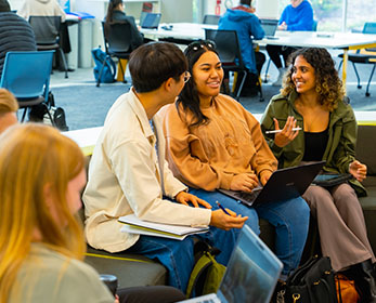 Students enjoy collaborative study in the open study space at Joondalup Campus Library, Lower Level 1.