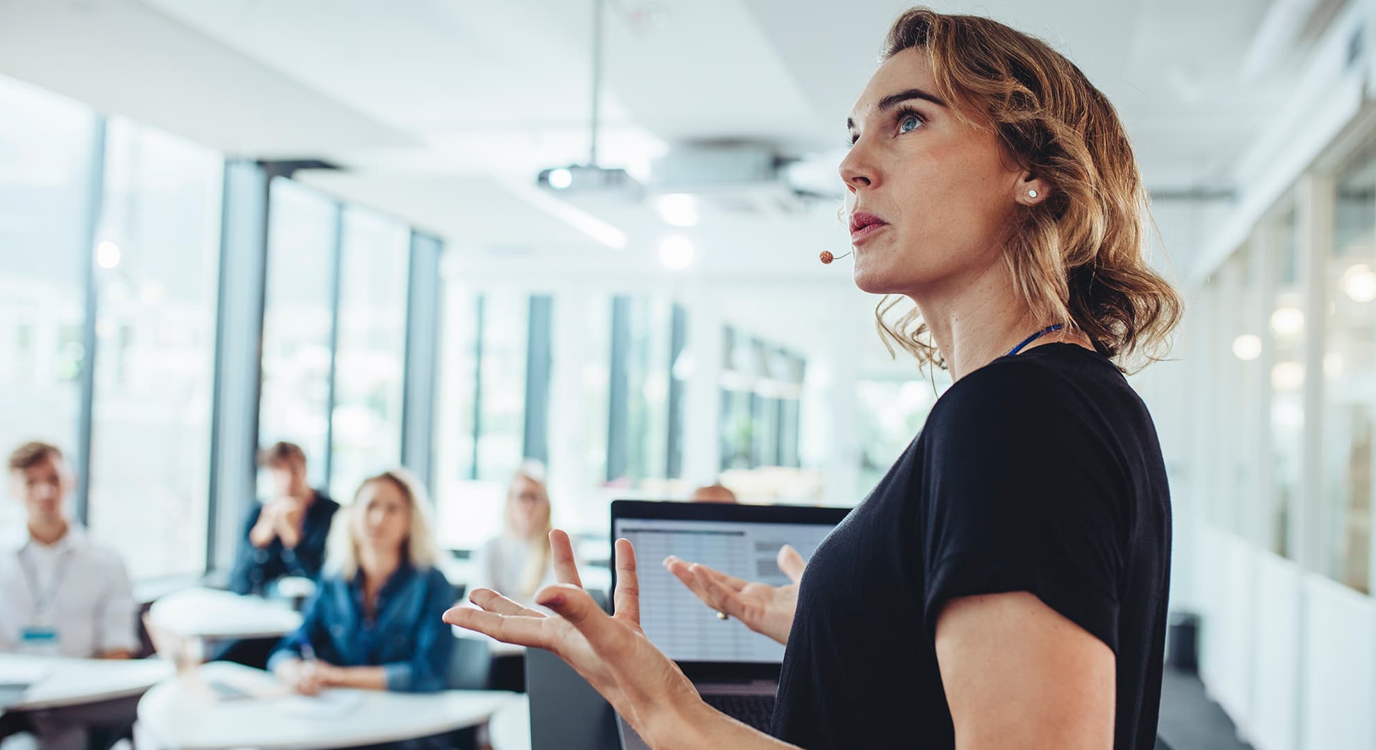 Woman lecturing students