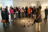 People observing the artwork in the YAM exhibition.