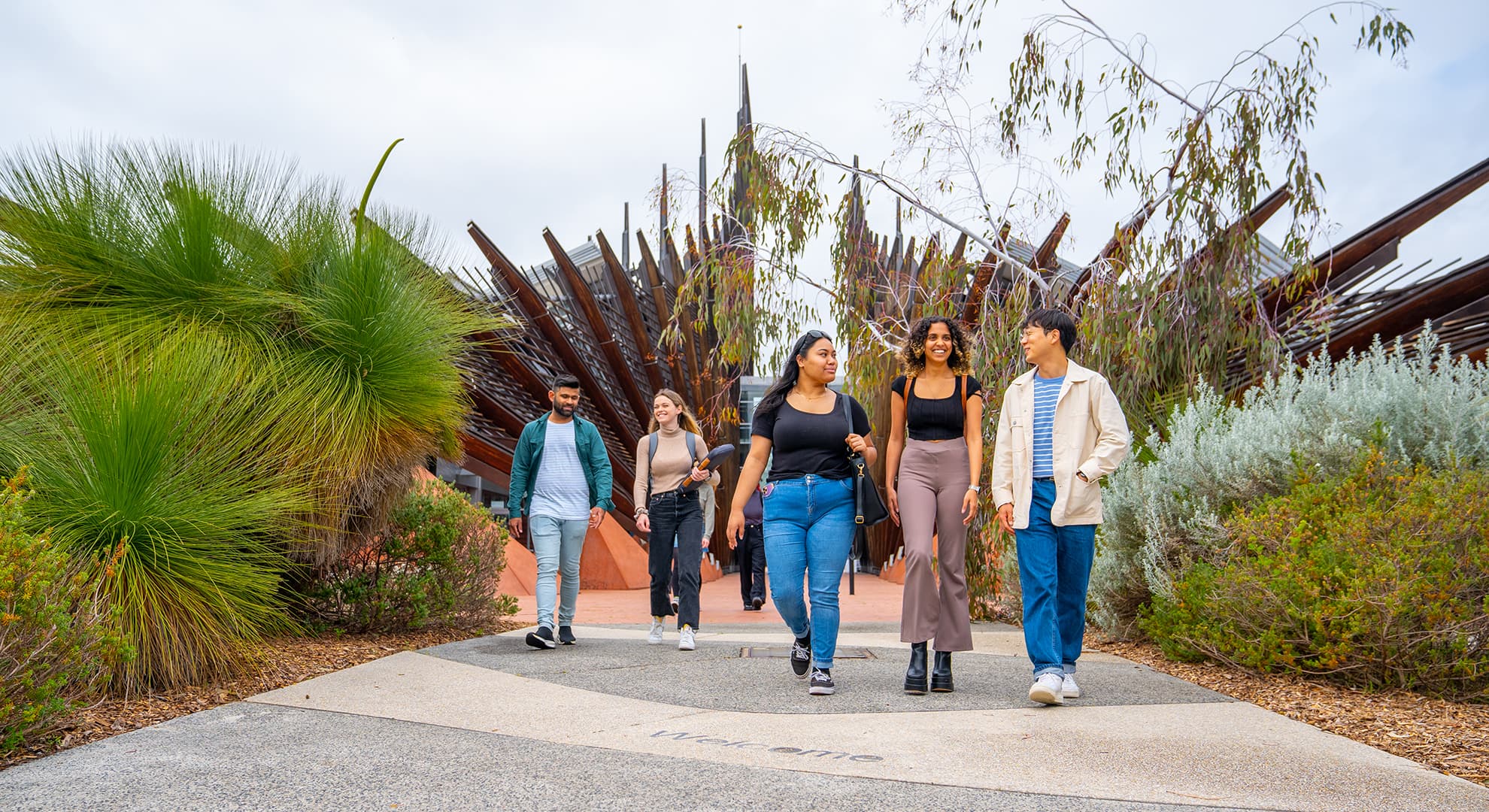 A group of ECU students walk around Joondalup Campus.