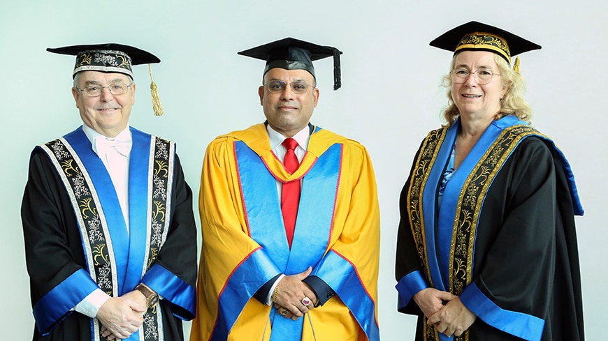 ECU Vice-Chancellor Professor Steve Chapman, Mr Rosh Jalagge and ECU Chancellor Denise Goldsworthy AO are dressed in full regalia a caps at the September 2023 ECU graduation ceremony.