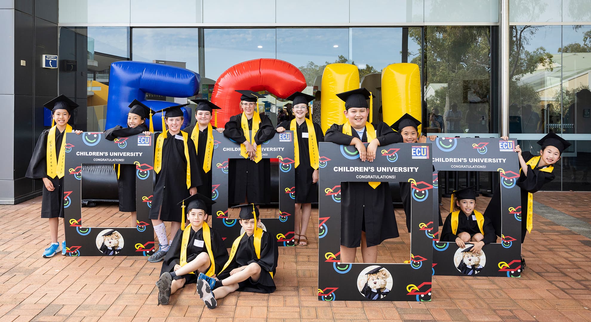 Children graduating at ECU.