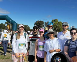 Photo of the research team outdoors at a fundraising event