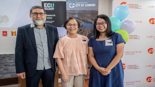 Three people posing for the camera