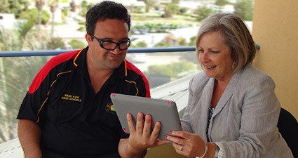 Professor Beth Armstrong and Research Assistant Mark Berg reviewing data.