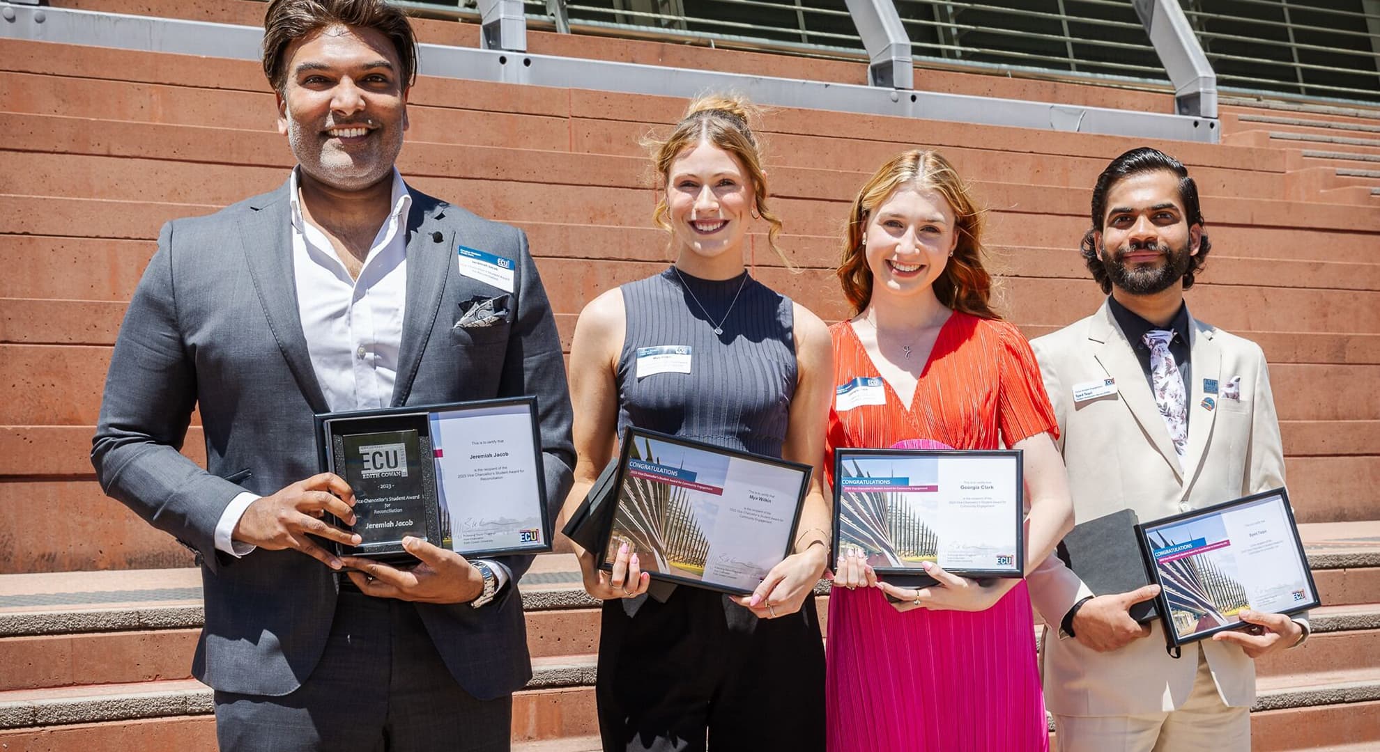 Jeremiah Jacob, Mya Wilkin, Georgia Clark and Syed Taqvi stand proudly holding their Vice-Chancellor's Student Awards.
