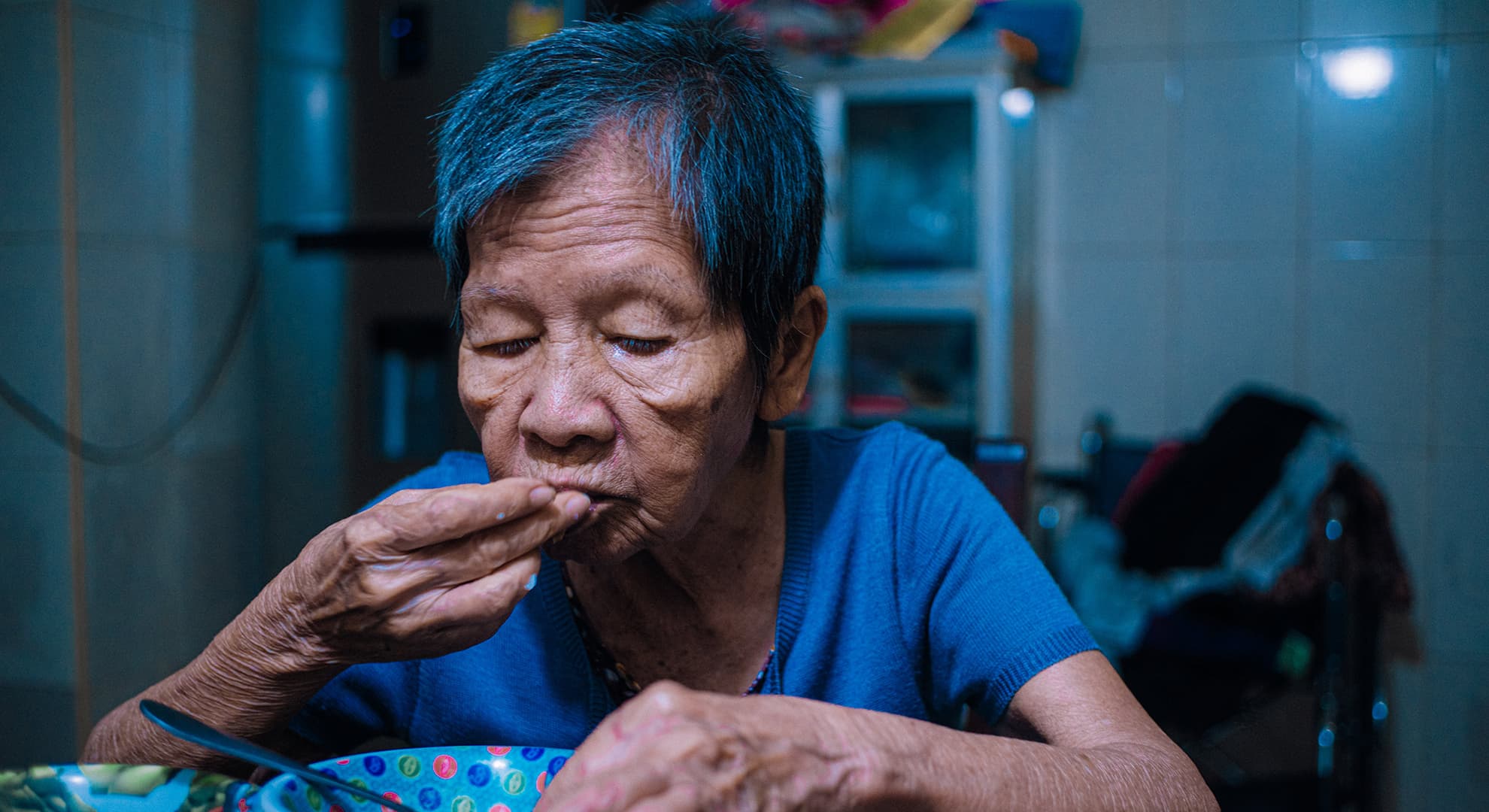 Old woman eating.