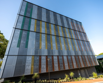 Image of a building with a very large periodic table mural