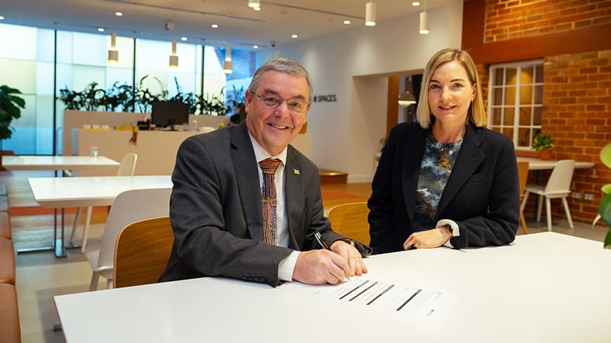 Man and woman in an office sitting at a table