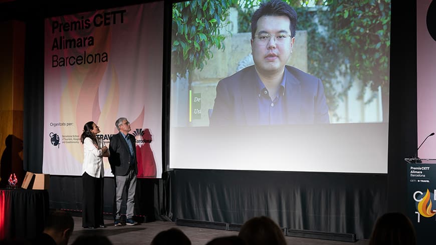 Dr Jun Wen delivering an acceptance speech via video at the 2023 CETT Alimara Awards in Barcelona.
