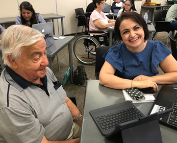 People being taught how to use computers.