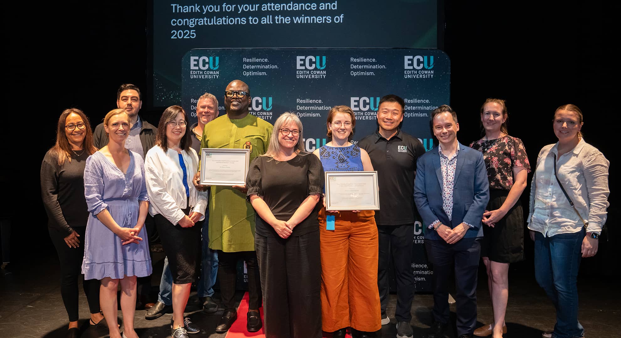 A group of people with awards