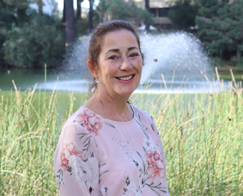 A portrait image of Ms Louise Campbell in front of the ECU Joondalup Lake