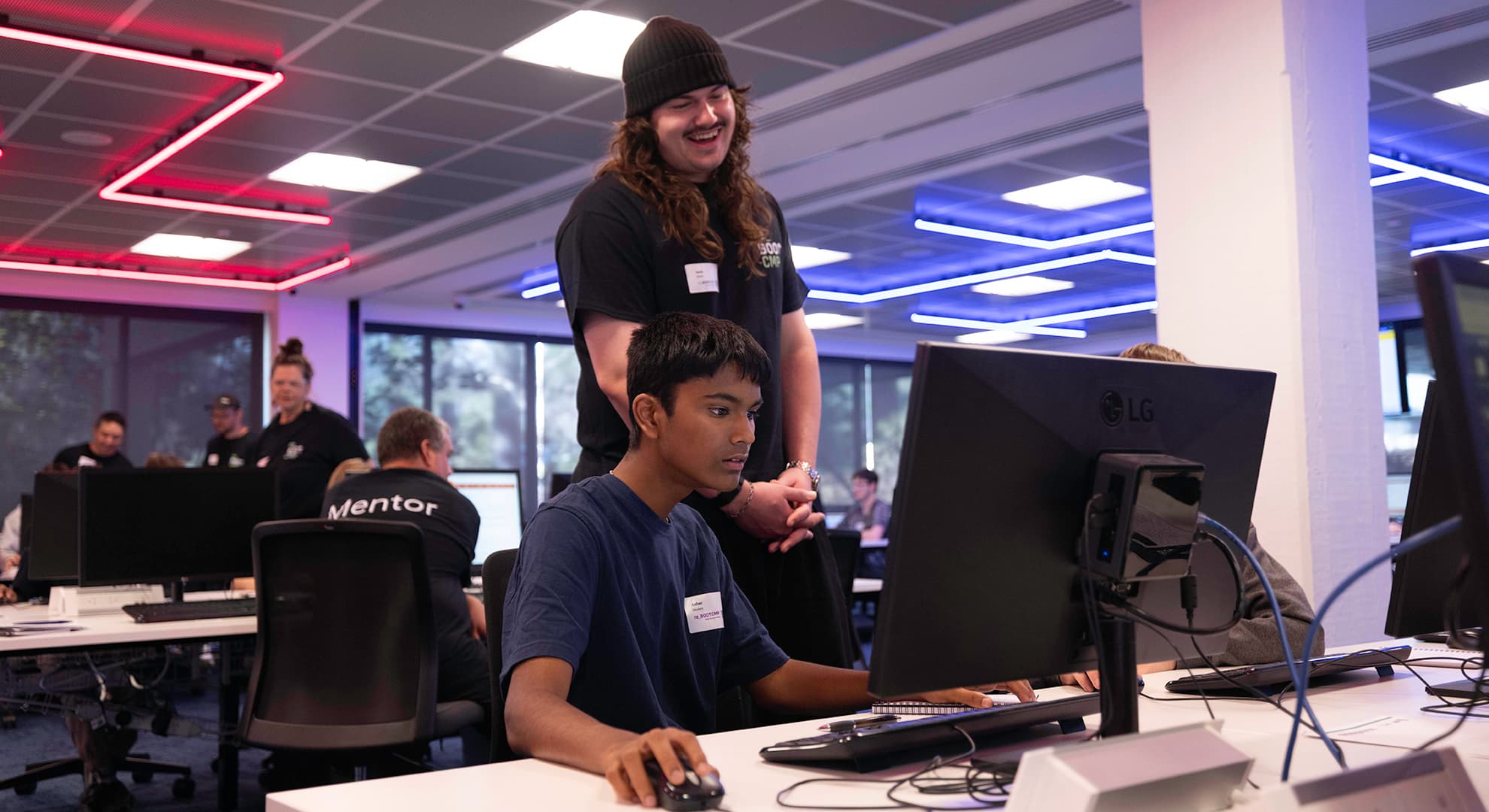 Mentor and student at computer