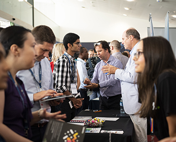 A photo of students interacting with prospective employers.