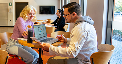 Two students meeting in the library