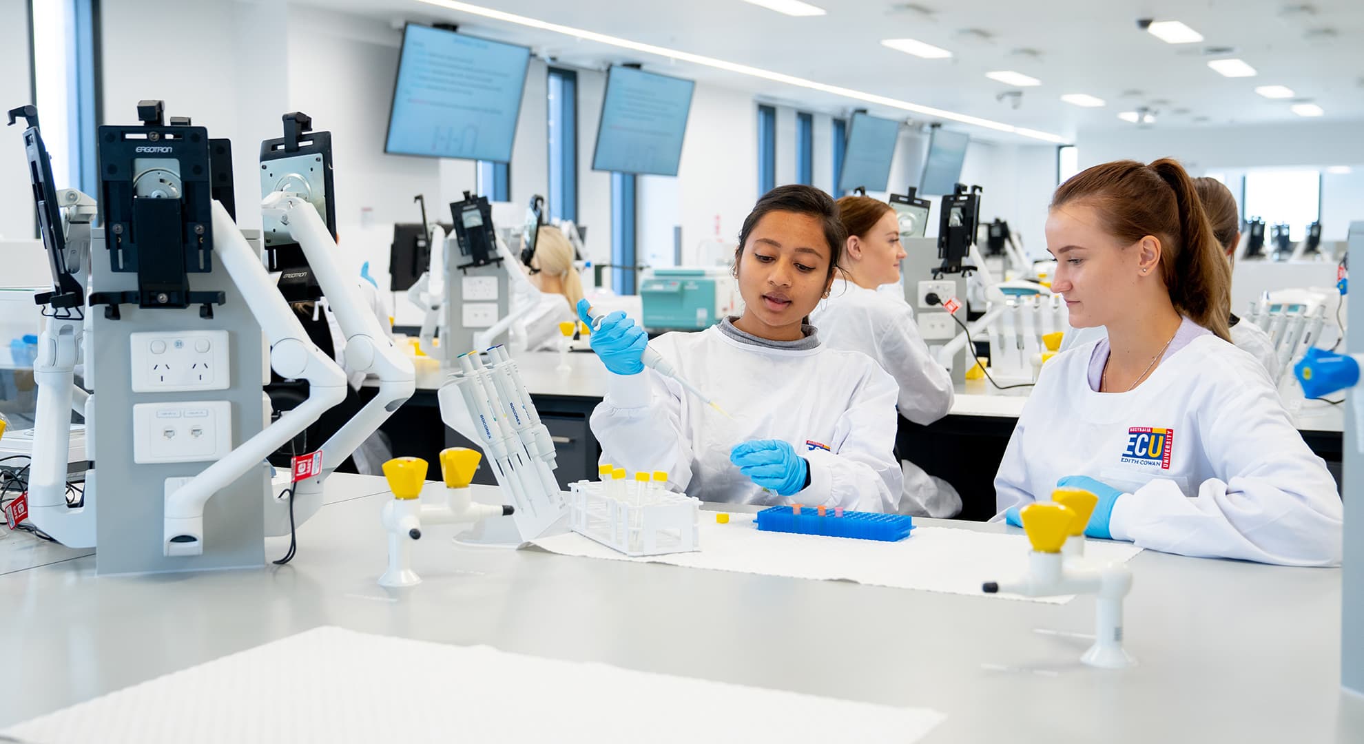 Two students working in a science lab.