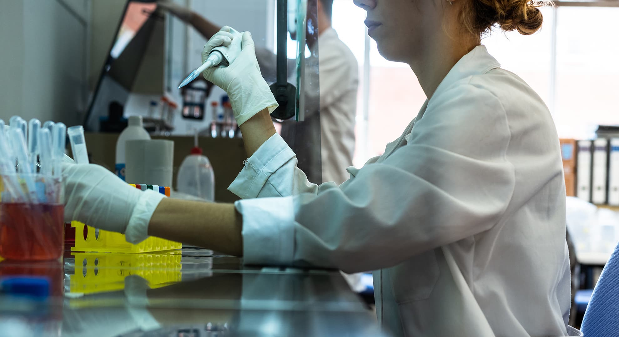 A scientists with test tube in ECU lab