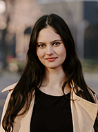 Photo of a female PhD student with long dark hair