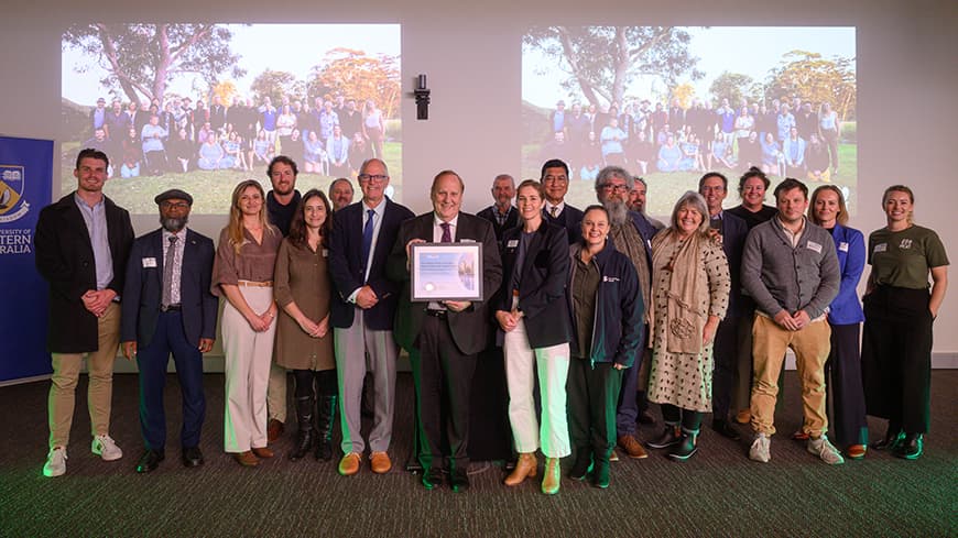 Group of people receiving a research grant.