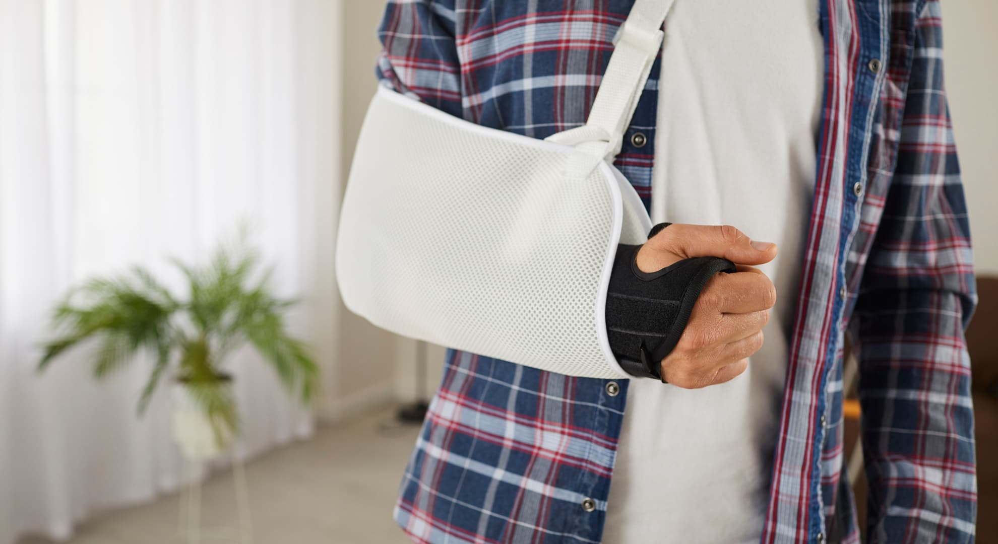 Man with a broken arm in a cast