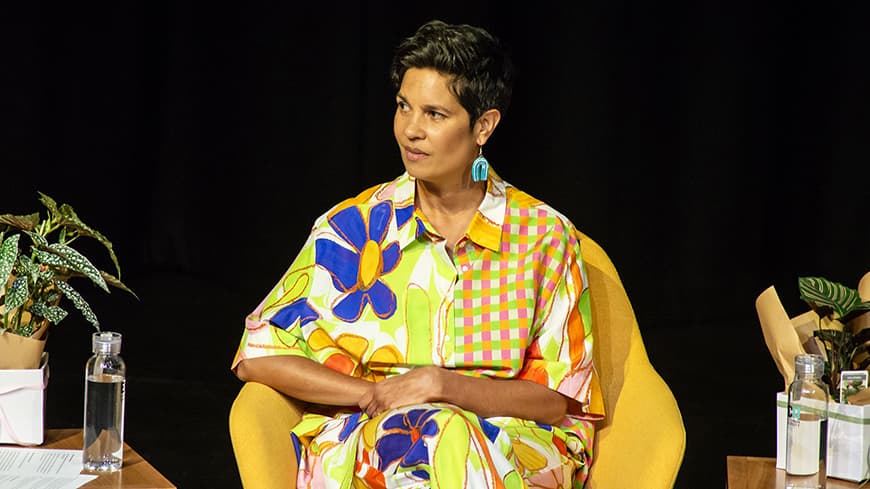 Narelda Jacobs listening intently while seated on the panel at the IDAHOBIT Lecture.