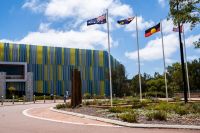 Three flag poles, part of the Boorna Baronga Cultural Reflection Space at the Joondalup Campus