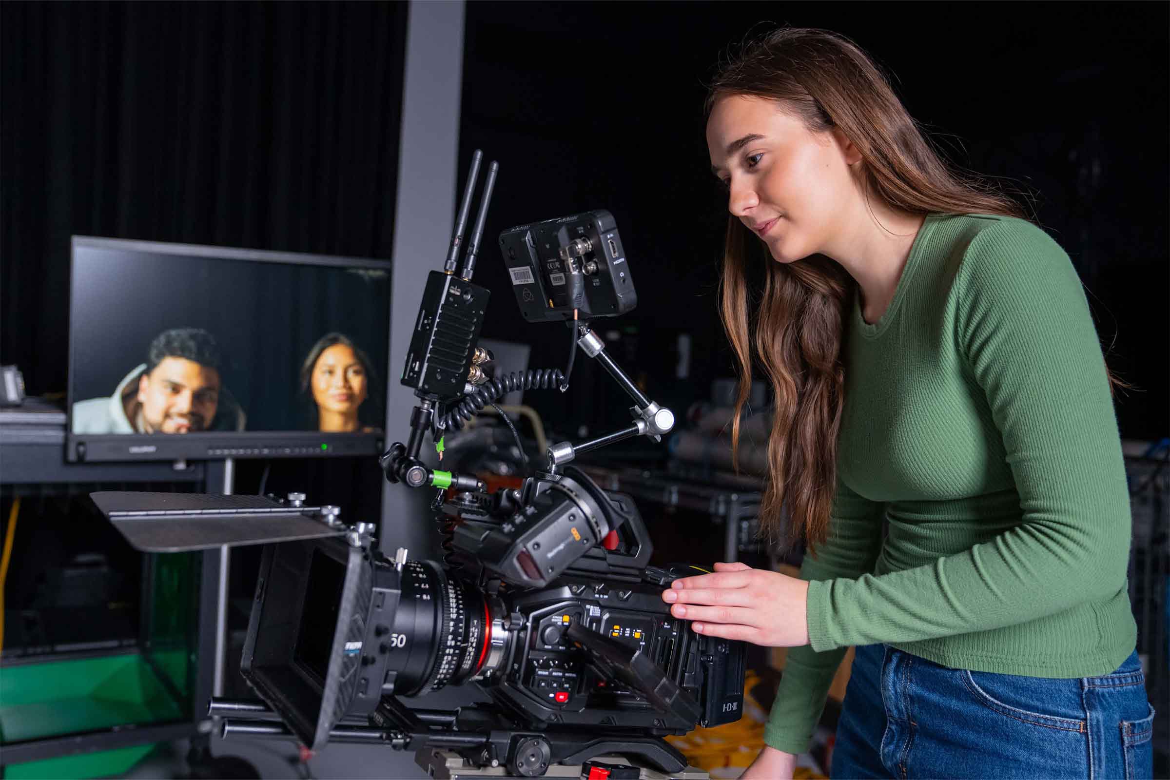 ECU City Broadcasting student operating a camera.
