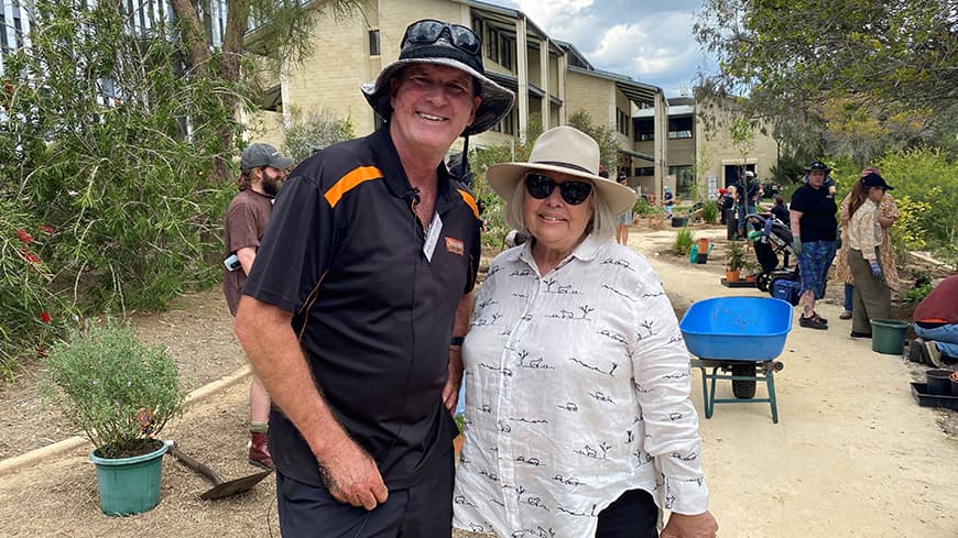 Mark Tucek and Aunty Dale Tilbrook standing in the garden
