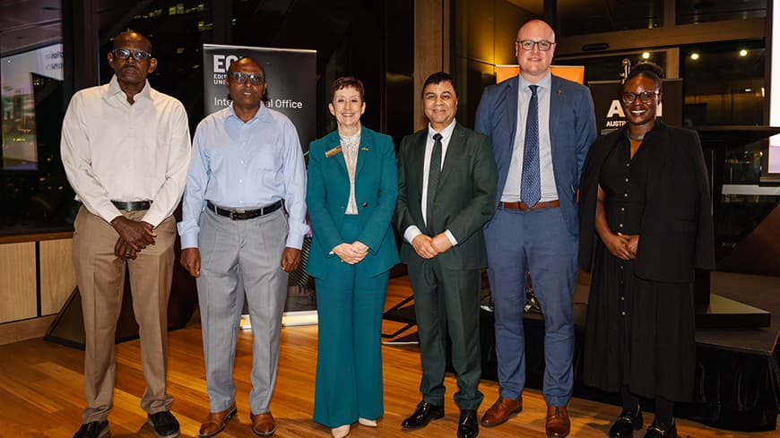Forum members group photo including Vice-Chancellor