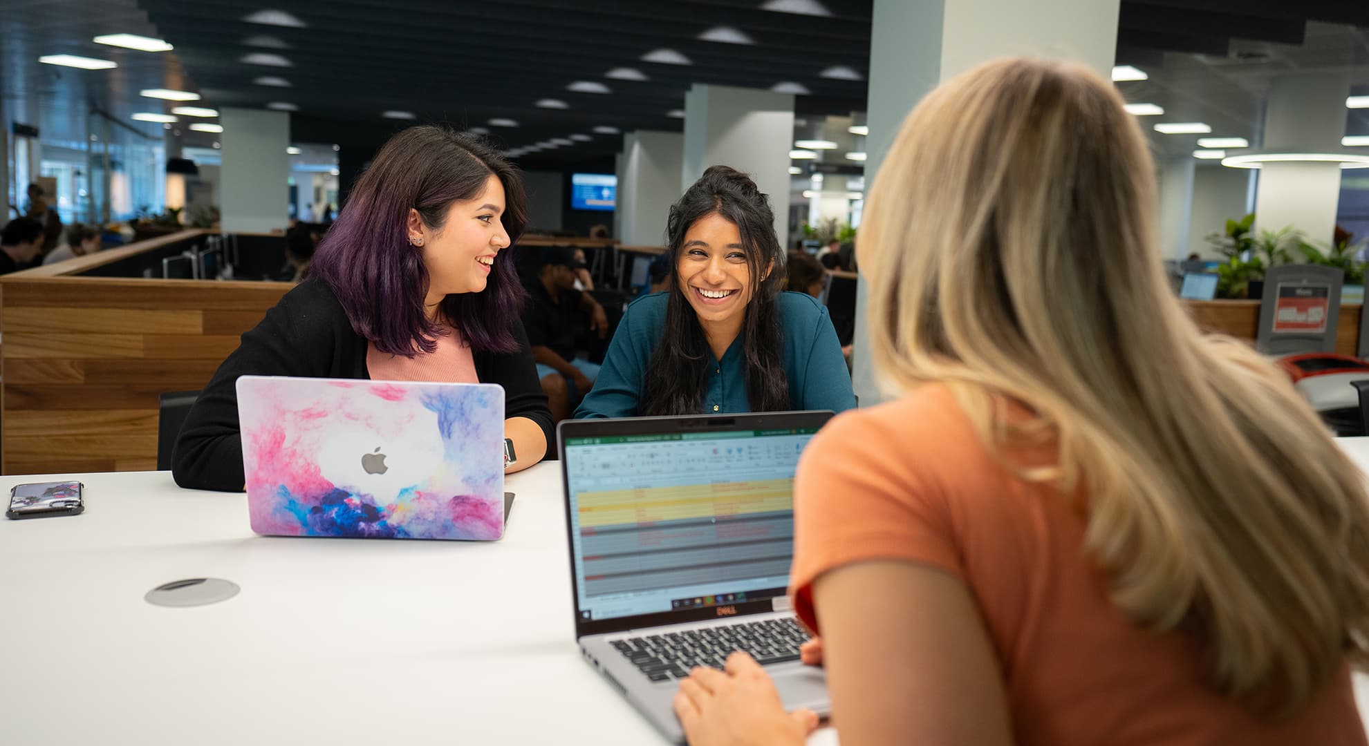 Female students sitting around a table