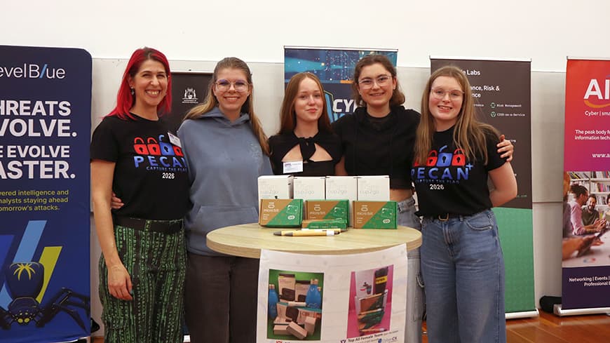 Group of girls standing in front of banners
