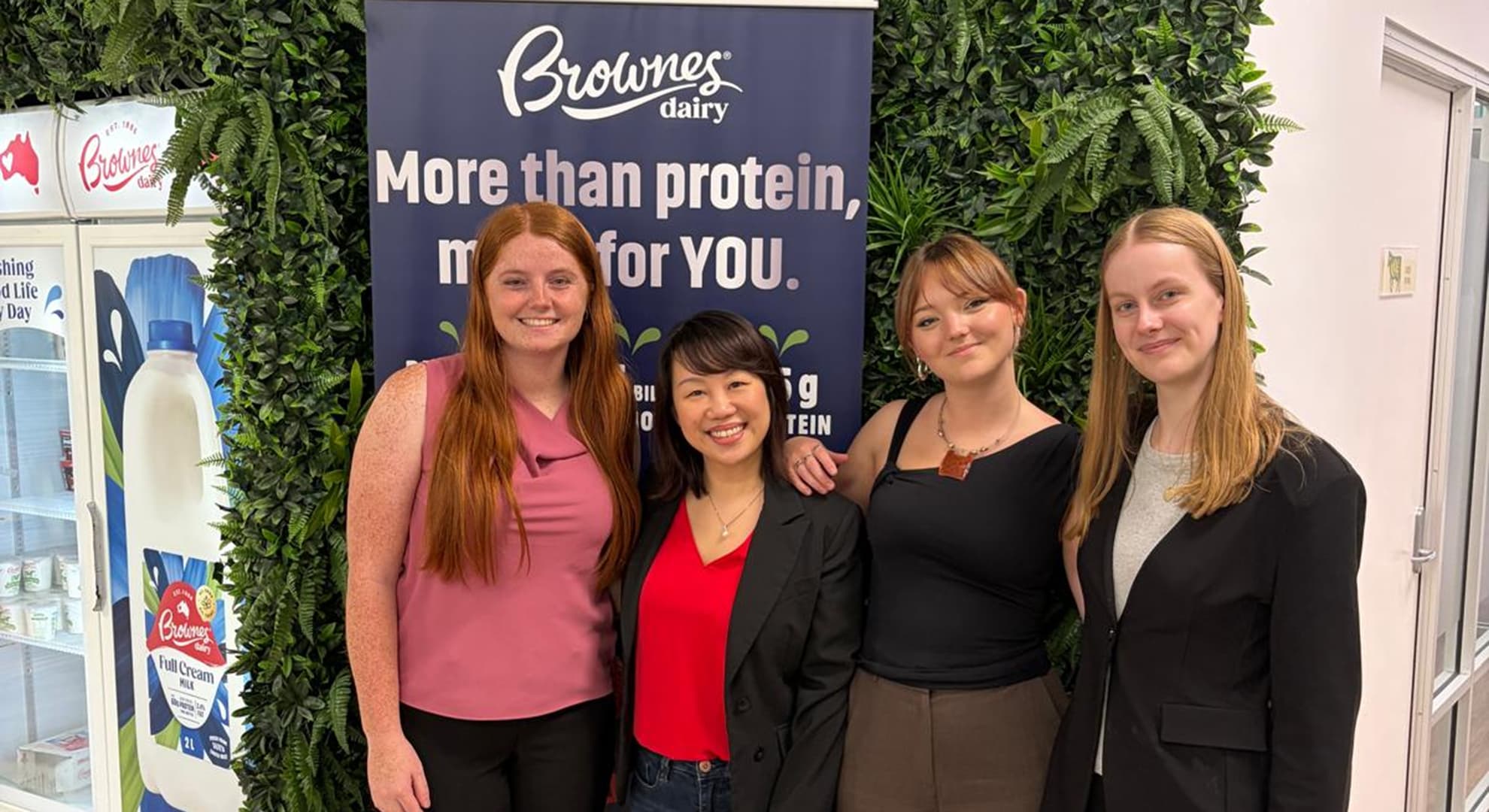 Brownes Dairy employees Samantha Fischer, Ciara Wood and Lauren Warnock with marketing lecturer and researcher Dr Melissa Fong-Emmerson at the Brownes Dairy facility.